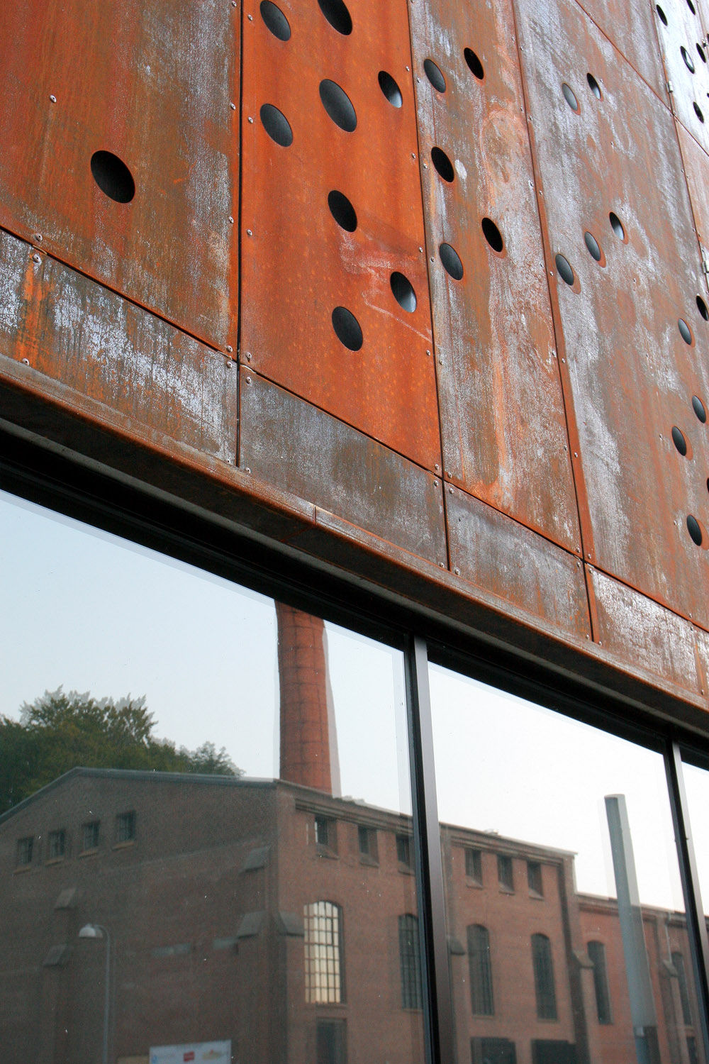 Perforated Rust Red Steel Panels Covering Whole Façade 491 Filt3rs